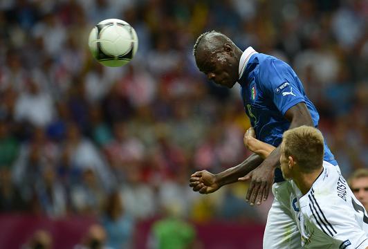 Mario Balotelli heads Italy into the lead against Germany